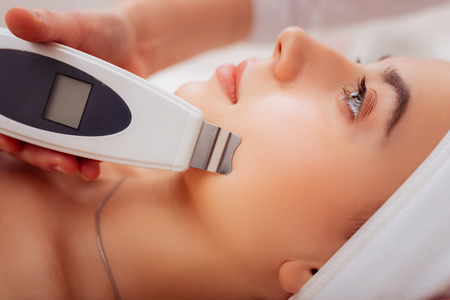 Special technology. Close up of a special device being in use for face cleansingの写真素材
