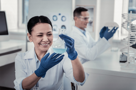 Chemical flask. The scientist is making the important experiment with chemicalsの写真素材