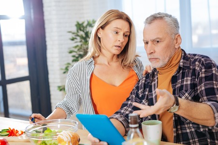 Problems at work. Loving caring wife feeling worried while calming her husband having problems at...