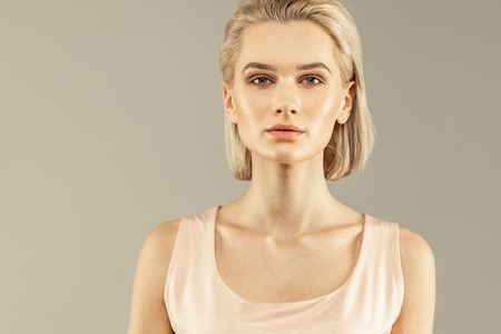 During the photoshoot. Beautiful female model looking at the camera while posing for a photoの写真素材