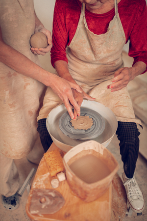 Special equipment. Top view of a professional ceramics jigger being used for pot makingの写真素材