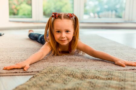 Positive mood. Cheerful pretty girl smiling while looking at youの写真素材