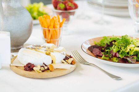 Appetizing dishes served on a spacious table in a restaurantの写真素材