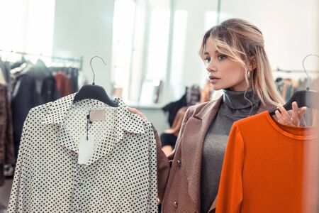 Blue-eyed businesswoman. Stylish blue-eyed businesswoman feeling joyful while shopping at the weekendの写真素材