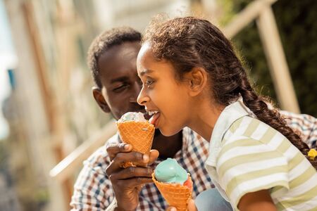 Kind man feeling happiness while spending day with his daughterの写真素材