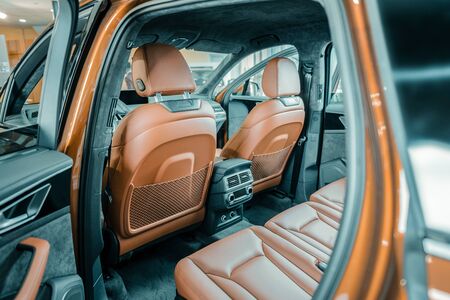 Not bought yet. New empty car with the doors opened standing in the automobile showroom.の写真素材
