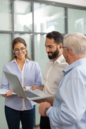 New candidate. Cheerful male person keeping smile on his face while presenting his startup