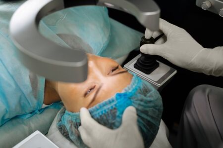 Medical checkup. Pleasant young woman having her eyesight checked while having a medical checkup
