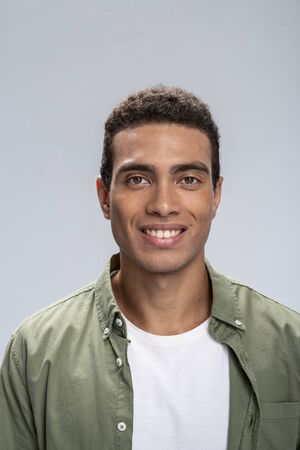 Good-looking young male smiling being happy