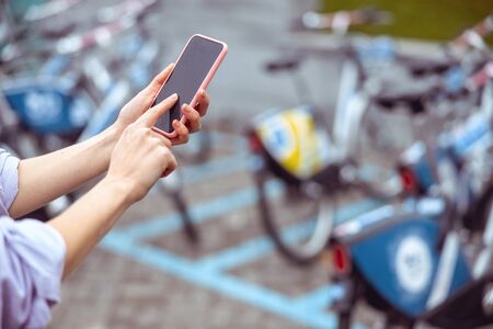 Cropped photo of woman hands using a mobile application on the phone