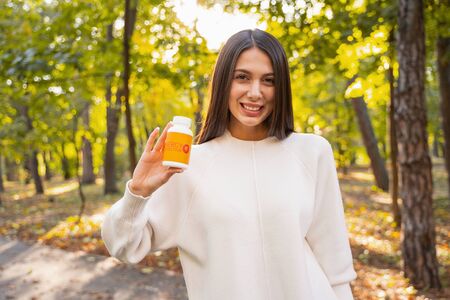 Cute female feeling happiness while having good resultsの写真素材