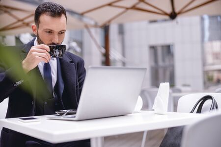 Just attention. Attentive businessman staring at screen of his computer while checking his mail box