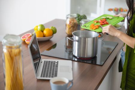 Cropped photo of a girl cooking a healthy soupの写真素材