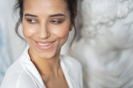 Caucasian woman looking at somebody in art studio. Female beauty conceptの写真素材