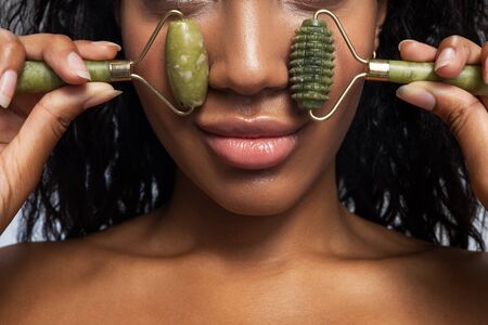 Cropped photo of young woman enjoying facial massage. Perfect skin conceptの写真素材