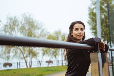 Have idea. Relaxed longhaired girl expressing positivity while being alone outsideの写真素材