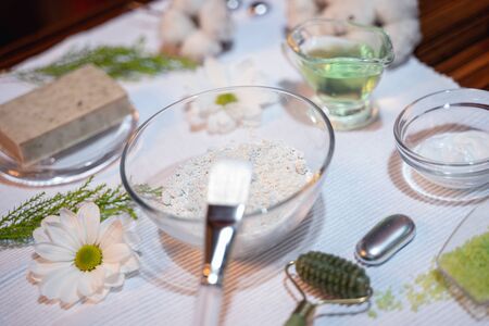 Closeup of body and face care products arranged on a deskの写真素材