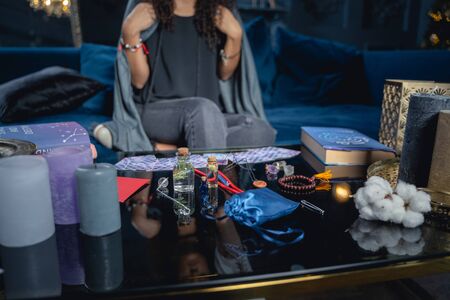 Cropped photo of a female sitting on a sofaの写真素材