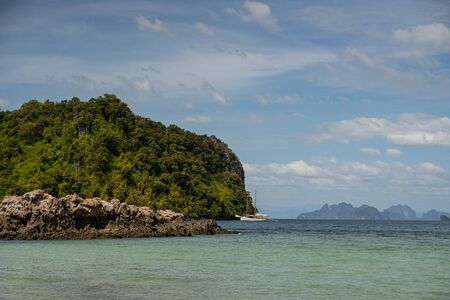 Green rock being a part of excursionの写真素材