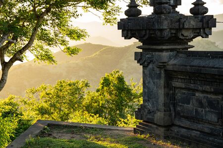 Beautiful view of ancient architectural construction with green trees and hills on background stock photoの写真素材