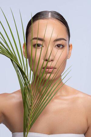 Attractive female person looking straight at camera, shooting in studioの写真素材