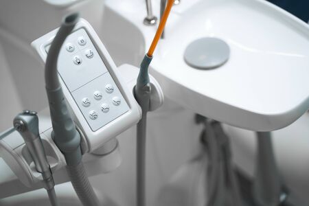 Close up of special electronical machine in dentist office for trating patients and curing teethの写真素材