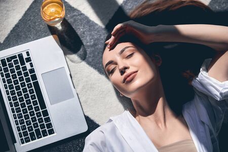 Beautiful female student having nap after studying online stock photo. Lifestyle conceptの写真素材