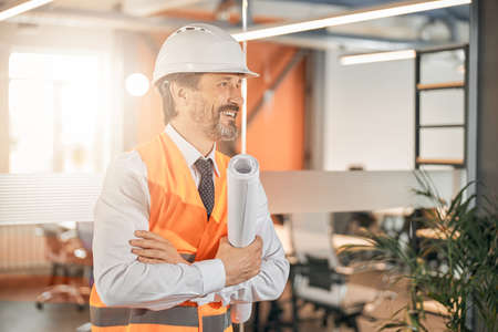 Close up portrait of confident builder feeling proud while standing in the open space officeの写真素材