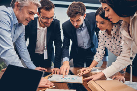 Man and woman analyzing management strategy for corporate company during collaboration