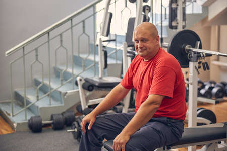 Close up portrait of male looking at the camera while spending time in the gym