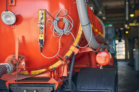 Focused photo on special auto standing on the foreground and being under control in hangarの写真素材