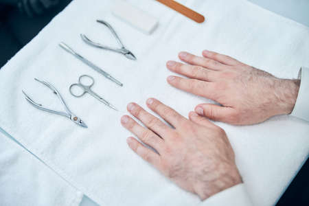 Sterile instruments lying on the table while being ready for professional use