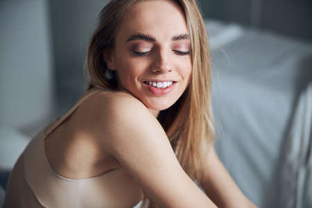 Happy female in the brassiere posing for the cameraの写真素材