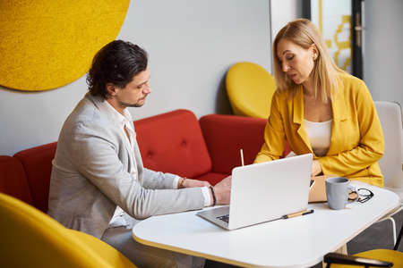 Two young people working at their idea