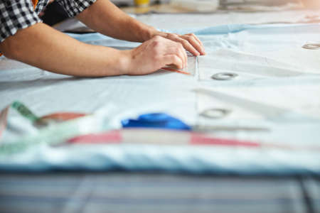 Plastic square used by a person working with fabric