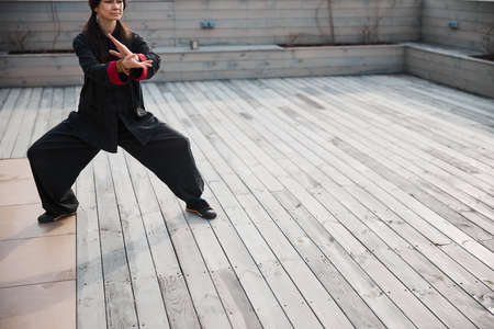 Qigong form moving left hand over rightの写真素材