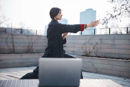 Woman pushing right hand forward during wushuの写真素材