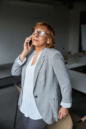 Attentive businesswoman listening to her interlocutor onlineの写真素材