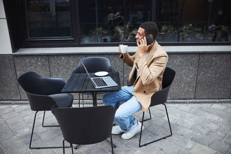 Young international man enjoying his coffee break