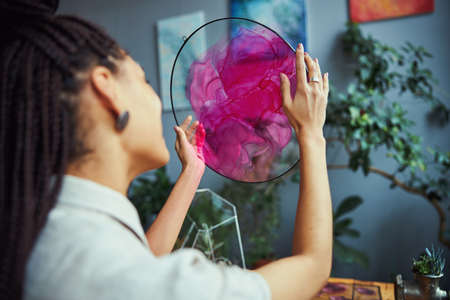 Professional artist viewing a beautiful abstract painting