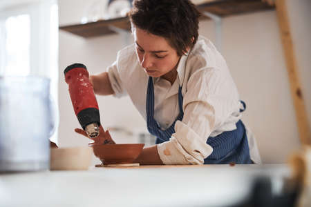 Concentrated potter finishing to dry clay product