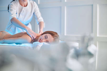 Gorgeous Caucasian female enjoying spa relax complex in beauty center