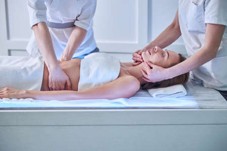 Beautiful lady enjoying spa day in spa center