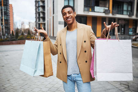 Young happy man looking straight at cameraの写真素材