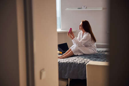 Relaxed female person spending her morning at homeの写真素材