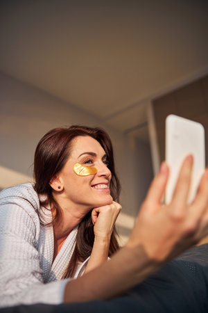 Cute young female shooting stories for her blogの写真素材