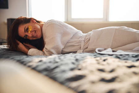 Pleased woman enjoying her lazy home day