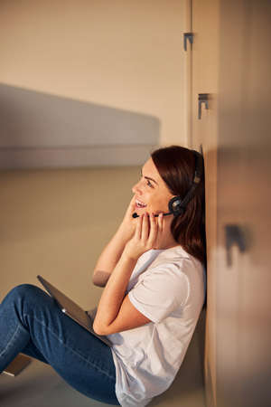 Amazing operator consulting her client with pleasure