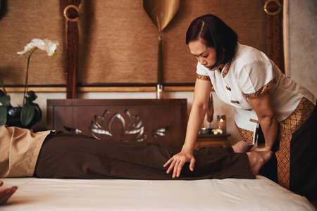 Professional Asian female manual therapist healing manの写真素材