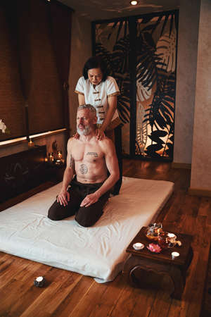 Grizzled man is coming for thai massageの写真素材